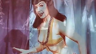 Vintage: Betty Page and Lucy Kraven posing and wrestling