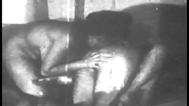 Grainy black and white footage of woman with nice boobs fucking and sucking