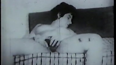 Black and white footage of thick chick with hairy pussy sucking cock on sofa