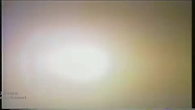a woman naked and in the dark