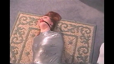Mummified Bondage Babe In Silver Tape