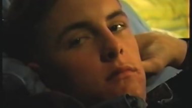 The same guy as the boy in orange T-shirt